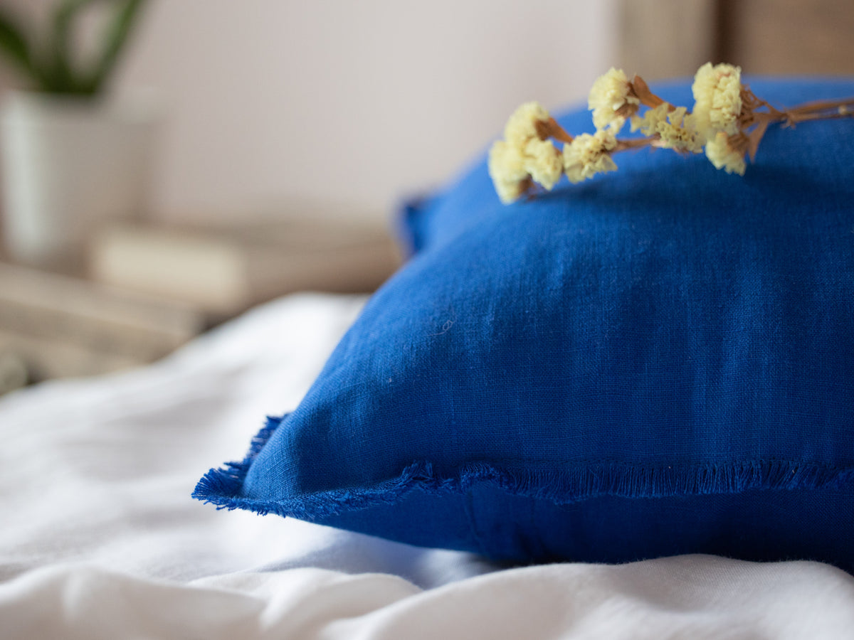 Blue pillow with a flower 