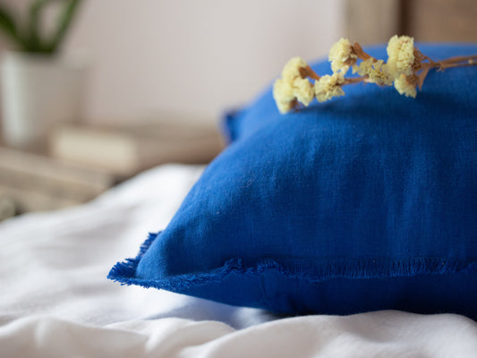 Blue pillow with a flower 