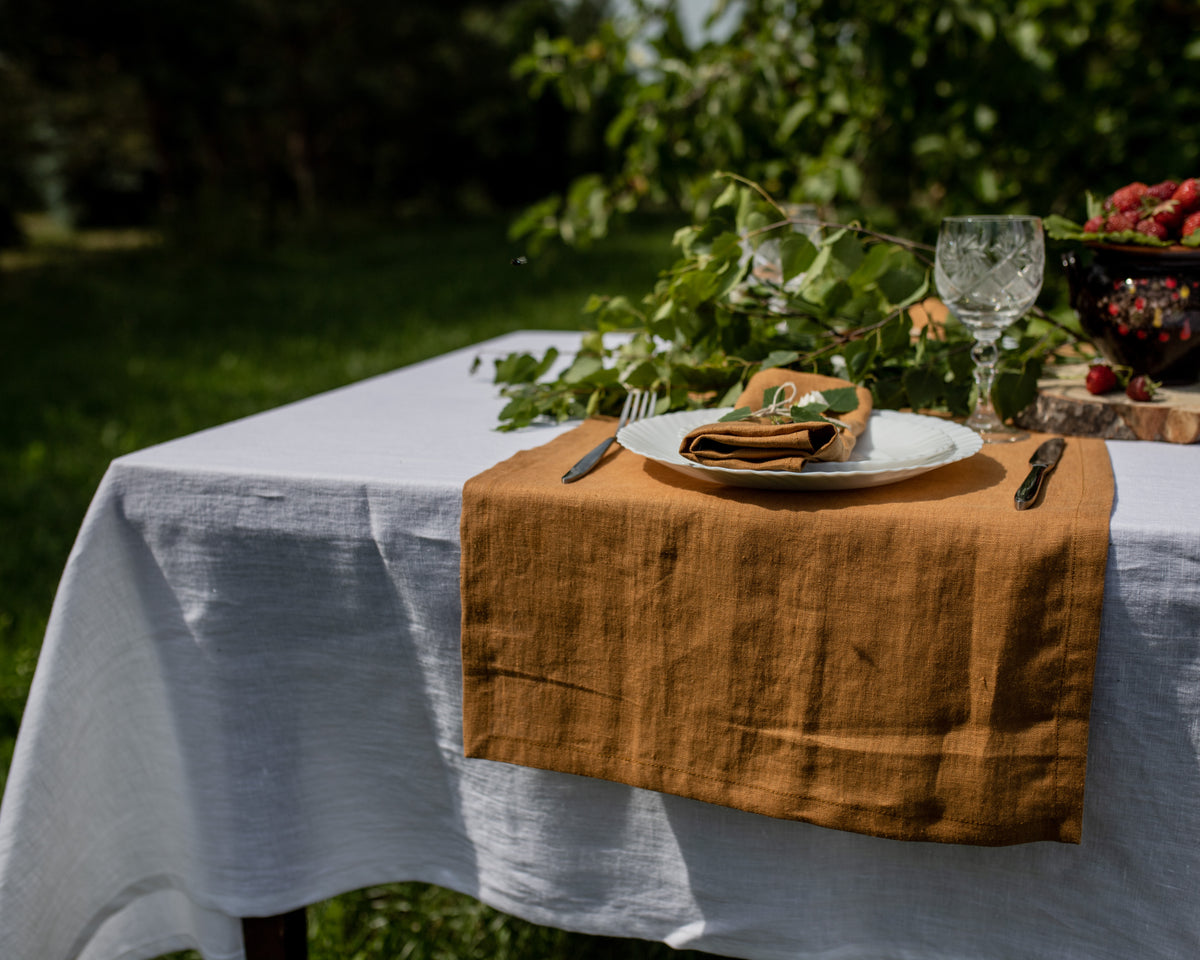 mustard linen table runner made from natural linen, handmade, on white table with greenery decor