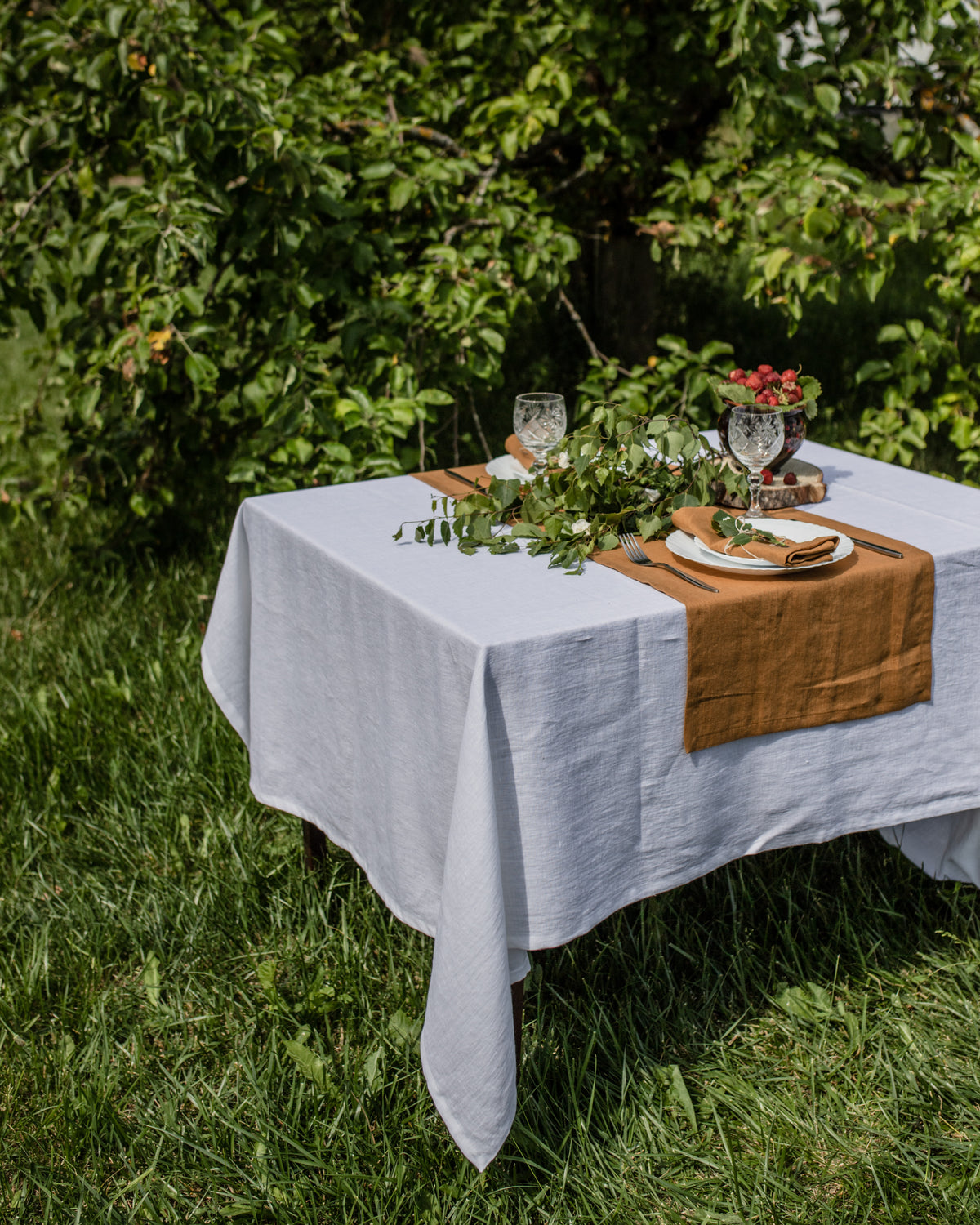 natural linen handmade mustard table runner with soft texture on table styled with rustic decor